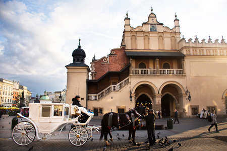Polish wait and ride horse drawn carriages for Pole people and foreigner travelers use service tour Krakow Old Town in Main Market Square at Stare Miasto on September 20, 2019 in Lesser, Polandのeditorial素材