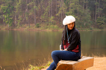 Travelers thai women journey travel visit and take photo between tour at Pang Ung lake in Pang Oung forest park or Switzerland of Thailand  in Chinese village Ban Rak Thai in Mae Hong Son, Thailandのeditorial素材