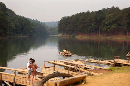 Rafting boat bamboo port for receive thai people and foreign travelers passengers tour Pang Ung lake in Pang Oung forest park at Ban Rak Thai on February 28, 2020 in Mae Hong Son, Thailandのeditorial素材