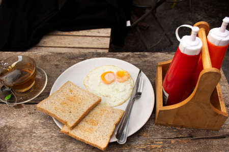 American Breakfast or Continental Breakfasts thai style in dining room in morning time for travelers and guest people eat and drinks at resort hotel at Pai city hill valley in Mae Hong Son, Thailandのeditorial素材