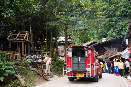 Thai people and foreign travelers walking travel visit Baan Mae Kampong village valley hill with traffic road on street of Doi Mon Lan mountain at Mae on on November 10, 2020 in Chiang Mai, Thailandのeditorial素材