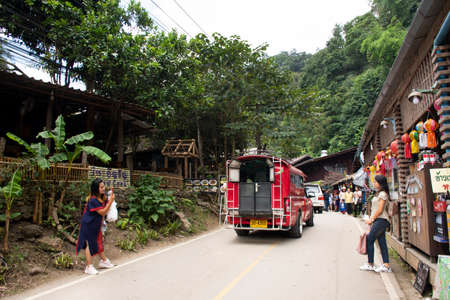 Thai people and foreign travelers walking travel visit Baan Mae Kampong village valley hill with...