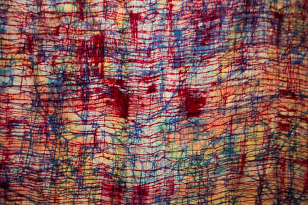 Cotton and silk fabric with batik and tie dye multicolor color background of traditional clothes...