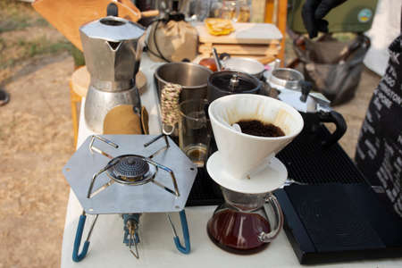 Tools equipment and material for thai men barista people use drip coffee maker or dripper made hot and iced coffee and tea for sale at outdoor of cafe shop at Bangbuathong city in Nonthaburi, Thailandの写真素材