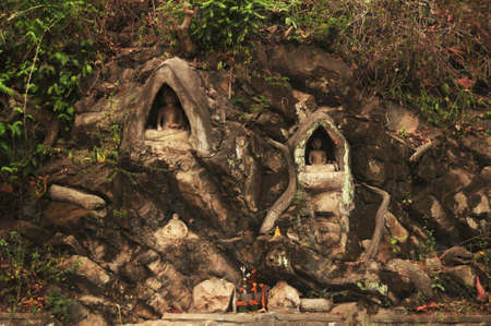 Small buddha statue and holy in wall of Wat Phou Si Stupa temple of Luangprabang lao city for...
