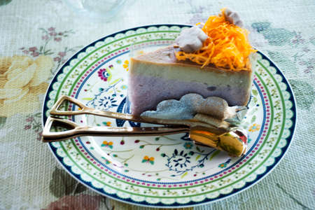 Homemade thai cake and egg custard with mung bean flour topping angel hair snack or portuguese fios de ovos recipe on vintage ceramic dish plate at cafe coffee shop restaurant in Bangkok, Thailandの写真素材