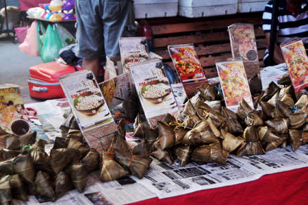 Malays chef cooking and sale traditional food cuisine gourmet malaysian style to people travelers on street floor shop at Filipino Market Kota Kinabalu at Borneo on April 12, 2015 in Sabah, Malaysiaのeditorial素材