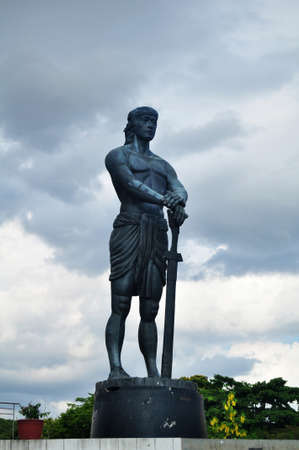 Statue of the Sentinel of Freedom or Lapu Lapu Monument on Valencia Circle in Rizal Park for Filipino people foreign travelers travel visit in Intramuros square at Maynila city in Manila, Philippinesのeditorial素材