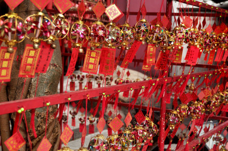 Small windmill amulet for sale Macanese people and foreign traveler travel visit and write on paper and hang up respect praying deity angel god buddha at Macao Region on April 19, 2015 in Macau, Chinaのeditorial素材