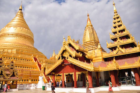 Shwezigon Pagoda Paya of burmese temple for burma people foreign traveler travel visit respect praying in Nyaung U town at Bagan or Pagan ancient heritage city on February 3, 2013 in Mandalay, Myanmarのeditorial素材