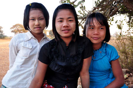 Burmese girl women group friends sit wait service travelers people for guide travel visit tour Ananda paya temple pagoda chedi at Bagan or Pagan city on February 2, 2013 in Mandalay, Myanmar or Burmaのeditorial素材