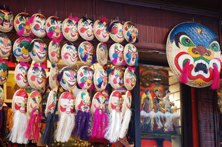 Vietnamese local souvenir gift shop bamboo wicker pannier basket traditional mask painting for sale travelers people in Ba Dinh Old Town Quarter Square at Hoan Kiem on July 7, 2012 in Hanoi, Vietnamのeditorial素材