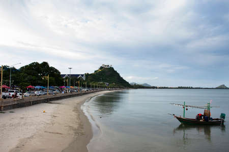 Fishermen maintenance and repair wooden fishing boat ship floating in sea at Prachuap Bay in Gulf of thai and waiting catch fish and marine life on September 6, 2021 in Prachuap Khiri Khan, Thailandのeditorial素材