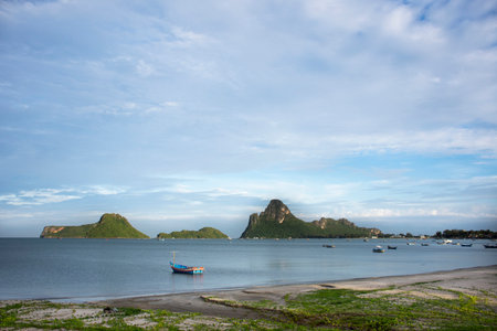 View landscape seascape and wooden fishing boat floating in sea waiting catch fish and marine life...