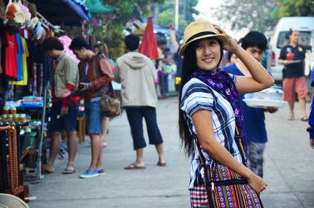 Travelers thai women people travel visit and portrait posing for take photo on Saphan Mon bridge local market bazaar in morning time at Sangkhla Buri city on February 2, 2014 in Kanchanaburi, Thailandのeditorial素材