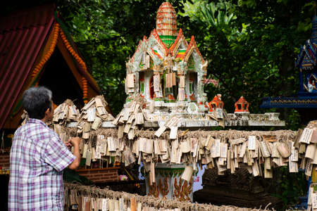 Phra Phum Shrine for thai people travel travel visit respect praying deity angel and write on bamboo plate for blessing of Baan Huay Nam Sai at Suan Phueng on November 1, 2021 in Ratchaburi, Thailandのeditorial素材