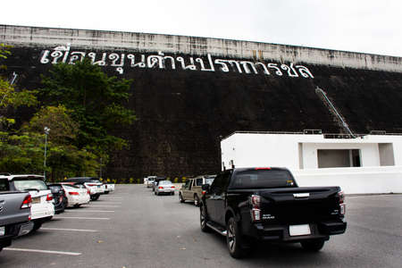 Thai people and foreign travelers stop car at parking for travel visit at Khun Dan Prakan Chon concrete dam or Khlong Tha-Dan Barrage Dam at Ban Tha Dan on November 13, 20121 in Nakhon Nayok, Thailandのeditorial素材
