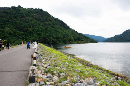 Thai people and foreign travelers travel visit and take photo on road street on top at Khun Dan...