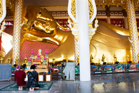 Thai people and foreign travelers travel visit respect praying and rite ritual blessing from reclining buddha at Wat Rat Prakhong Tham temple of Nonthaburi on November 28, 2021 in Bangkok, Thailandのeditorial素材