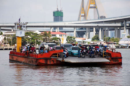 Thai passage ferryboat or ferry boat barge transport carry pick up vehicle crossing chao phraya river at Phra Pradaeng pier harbor at Samutprakarn city on December 26, 2021 in Samut Prakan, Thailandのeditorial素材