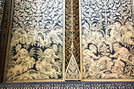 Ancient ruin mural drawing and frescoes painting on wooden door of antique building ubosot for thai people travelers travel visit at Wat Pho Bang O temple on March 15, 2022 in Nonthaburi, Thailandのeditorial素材
