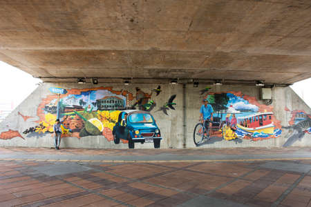 Travelers thai women travel visit posing portrait take photo with landmark street art painting and drawing design at Saphan Maha Chesadabodindranusorn Bridge on April 3, 2022 in Nonthaburi, Thailandのeditorial素材