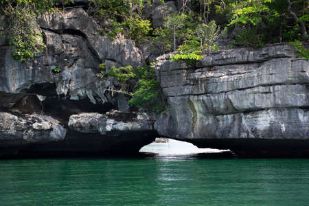 Limestone mountain island in sea ocean for thai people travelers travel visit local trip tour Prasat Hin Pan Yod of Mu Ko Petra National Park in Pak Bara waterfront at La ngu city in Satun, Thailandの写真素材