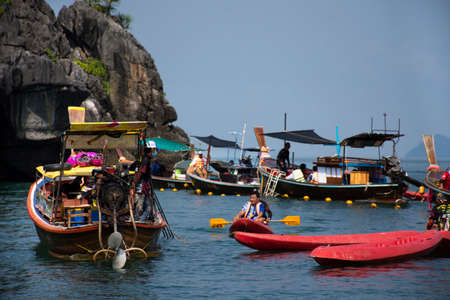 Local boat tour bring thai people travelers visit Ko Khao Yai and Prasat Hin Pan Yod and stop wait in sea ocean of Mu Ko Petra National Park in Pak Bara at La ngu on April 12, 2022 in Satun, Thailandのeditorial素材