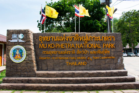 Stone tag and label information at Gate entrance of Mu Ko Petra National Park for thai people and foreign travelers travel visit at Pak Bara village at La ngu city on April 12, 2022 in Satun, Thailandのeditorial素材