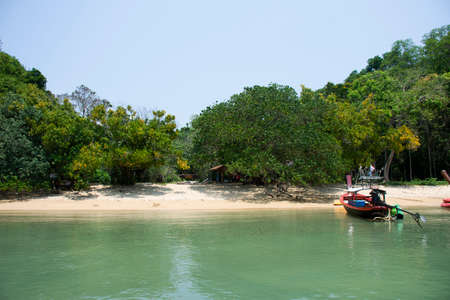 Local boat tour stop wait bring thai people travelers travel visit Ao Toa Ba beach and stop unseen trip in ocean of Mu Ko Petra National Park in Pak Bara at La ngu on April 12, 2022 in Satun, Thailandのeditorial素材