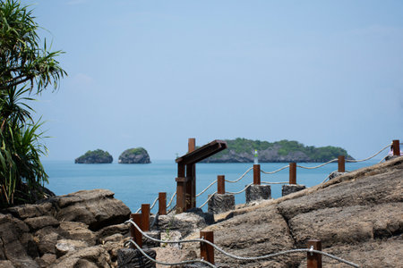 Walkway on cliff mountain for thai people foreign travelers travel visit unseen trip stone sea ââheart in ocean on Ao Toa Ba beach of Mu Ko Petra National Park in Pak bara at La ngu in Satun, Thailandの写真素材