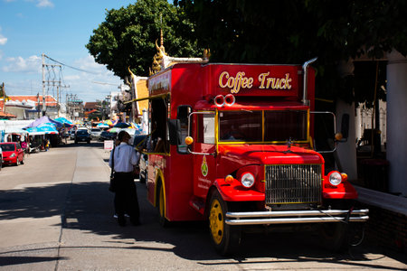 Modern retro vintage food truck and cafe coffee shop vehicle for thai barista brew drink and bakery to customer eat drinks on street road at Wat Nang Phaya on October 28, 2022 in Phitsanulok, Thailandのeditorial素材