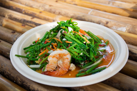 Traditional local cuisine thai fusion food fresh vegetable salad with spicy sour sauce and shrimp...