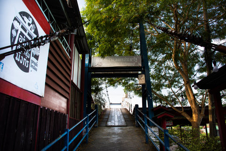Suspension wooden bridge for thai people and foreign traveler walking cross river canal to travel visit Sai Noi floating street market at Wat Sai Yai temple on November 22, 2018 in Nonthaburi Thailandのeditorial素材