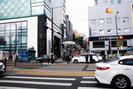 Landscape cityscape Nampodong city with korean people and foreign travelers walk and wait crossing...