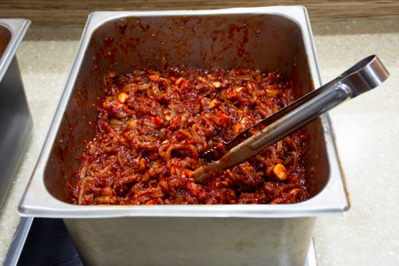Local traditional korean gourmet food fresh squid kimchi for korean people and foreign travelers travel visit and taste eat drinks in restaurant at Jeju city in Jeju do island, South Koreaの写真素材