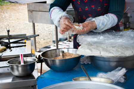 Local hawker stall traditional korean gourmet on street food bazaar market korean people cooking...