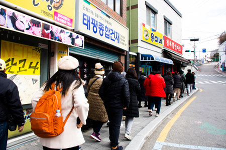 Korean people and foreign travelers journey travel visit and walk explore at Gamcheon Culture Village and colourful terraced house or Santorini of Pusan city on February 18, 2023 in Busan, South Koreaのeditorial素材