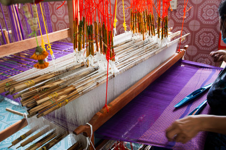 Thai craftsmanship technician professional use antique local wooden machine loom weaving hand woven...
