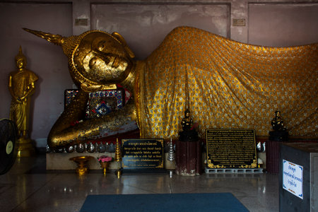 Ancient buddha reclining attitude statues of Wat Mahathat Worawihan temple for thai people travelers visit and respect praying blessing wish holy mystery on September 16, 2023 in Ratchaburi, Thailandのeditorial素材