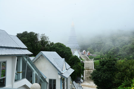 Naphamethinidon chedi and Naphaphonphumisiri pagoda stupa of Doi Inthanon mountain with mist rainning in morning for thai people travelers travel visit at Doi Luang or Ang Ga in Chiang Mai, Thailandの写真素材