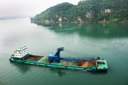 Chinese people barge and tugboat cargo ship delivery shipping in yangtze river with view landscape...