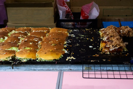 Traditional japanese pizza snack food or local cuisine teppanyaki savory pancake include okonomiyaki sauce for travelers people taste eat in hawker stall in Tanabata or Star Festival in Narita, Japanのeditorial素材