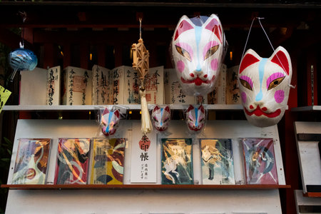 Handicrafts fox mask or handmade Kitsune mask and gifts amulets in local hawker stall grocery shop for japanese people travelers travel visit select buy at Narita city on July 7, 2024 in Tokyo, Japanのeditorial素材