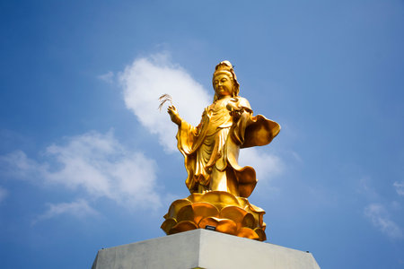 Ancient Golden Quan Yin angel deity or Kuan Yin gold chinese mercy goddess for thai people travel visit and respect praying wish holy mystery worship at Antique Chinese Shrine in Nonthaburi, Thailandの写真素材