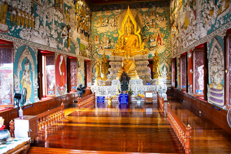 Ancient golden buddha statue in antique old ubosot for local thai people travelers travel visit respect blessing holy mystery of Wat Si Uthum Phon temple on November 2, 2024 in Nakhon sawan, Thailandのeditorial素材