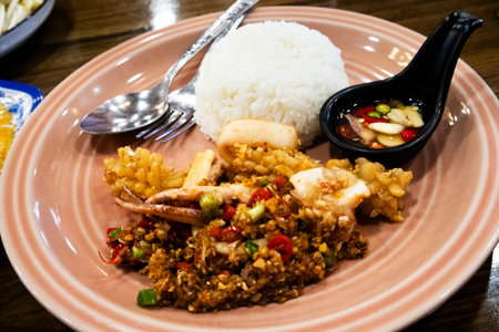Traditional cuisine thai food Rice with Stir-fried Chilli Garlic and Salt with seafood on ceramic dish serve customer eat drink at local  restaurant cafe shop at Khlong Bang Luang in Bangkok, Thailandの写真素材