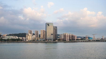 View landscape Lujiang river and cityscape urban area of Xiamen city from Gulangyu Island Town of Pianos for chinese people travelers travel visit colorful lamp lighting evening time in Fujian, Chinaの写真素材