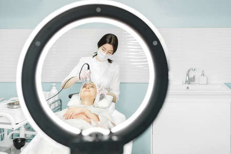 Young and beautiful girl in the clinic of natural beautyの写真素材