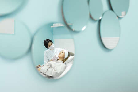 Young and beautiful girl in the clinic of natural beautyの写真素材